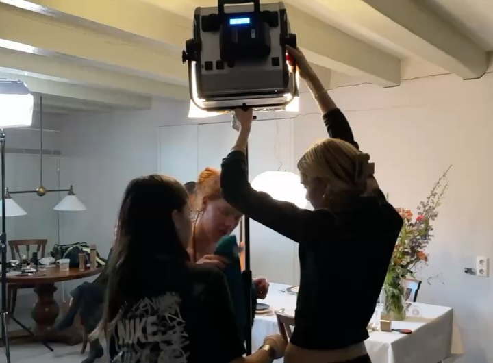 Behind the scenes: the crew working around the dining room set