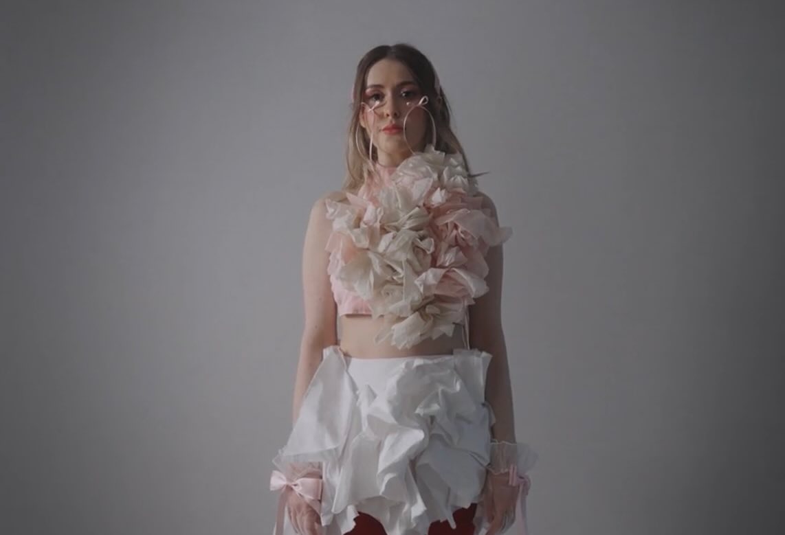 Film still: Dalia in the unravelling tulle look, closer in