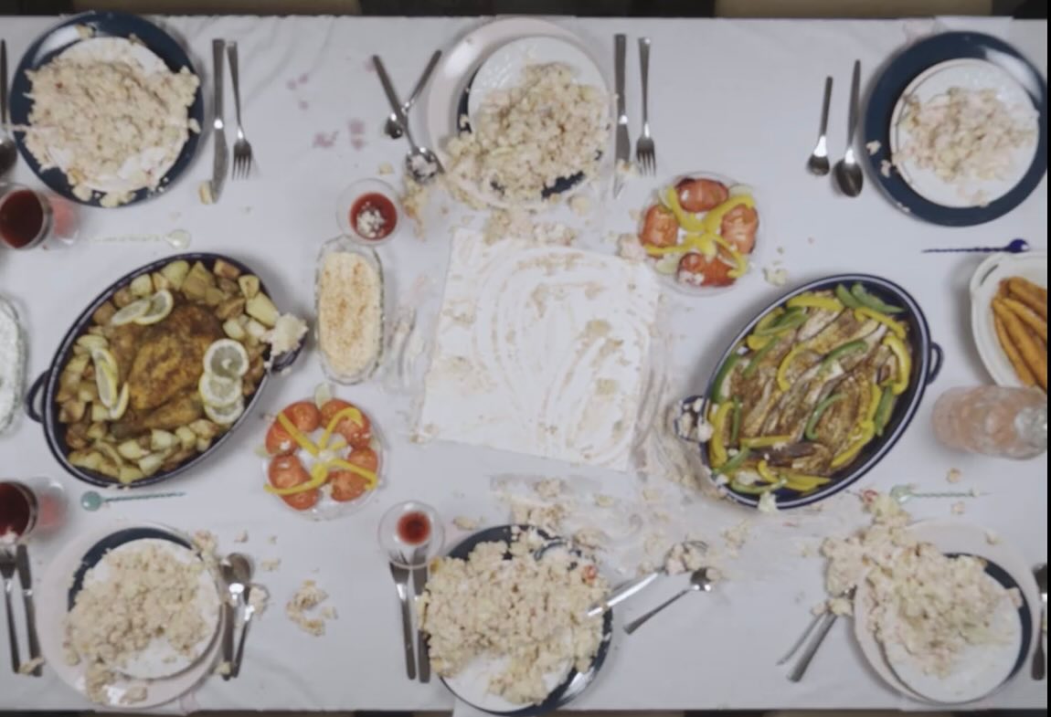 Film still: the table after the cake has been destroyed