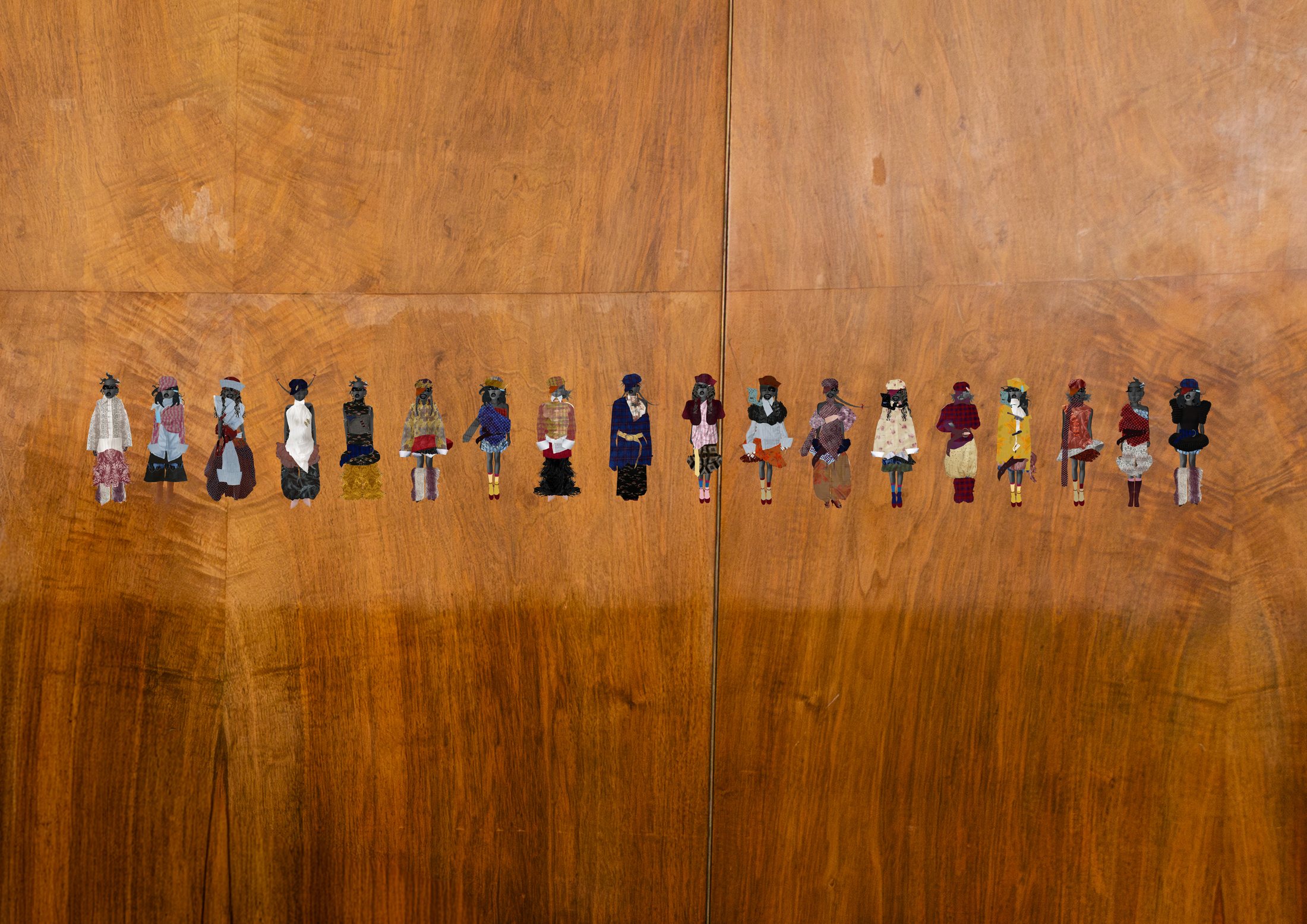 Full collection line-up against the wood wall